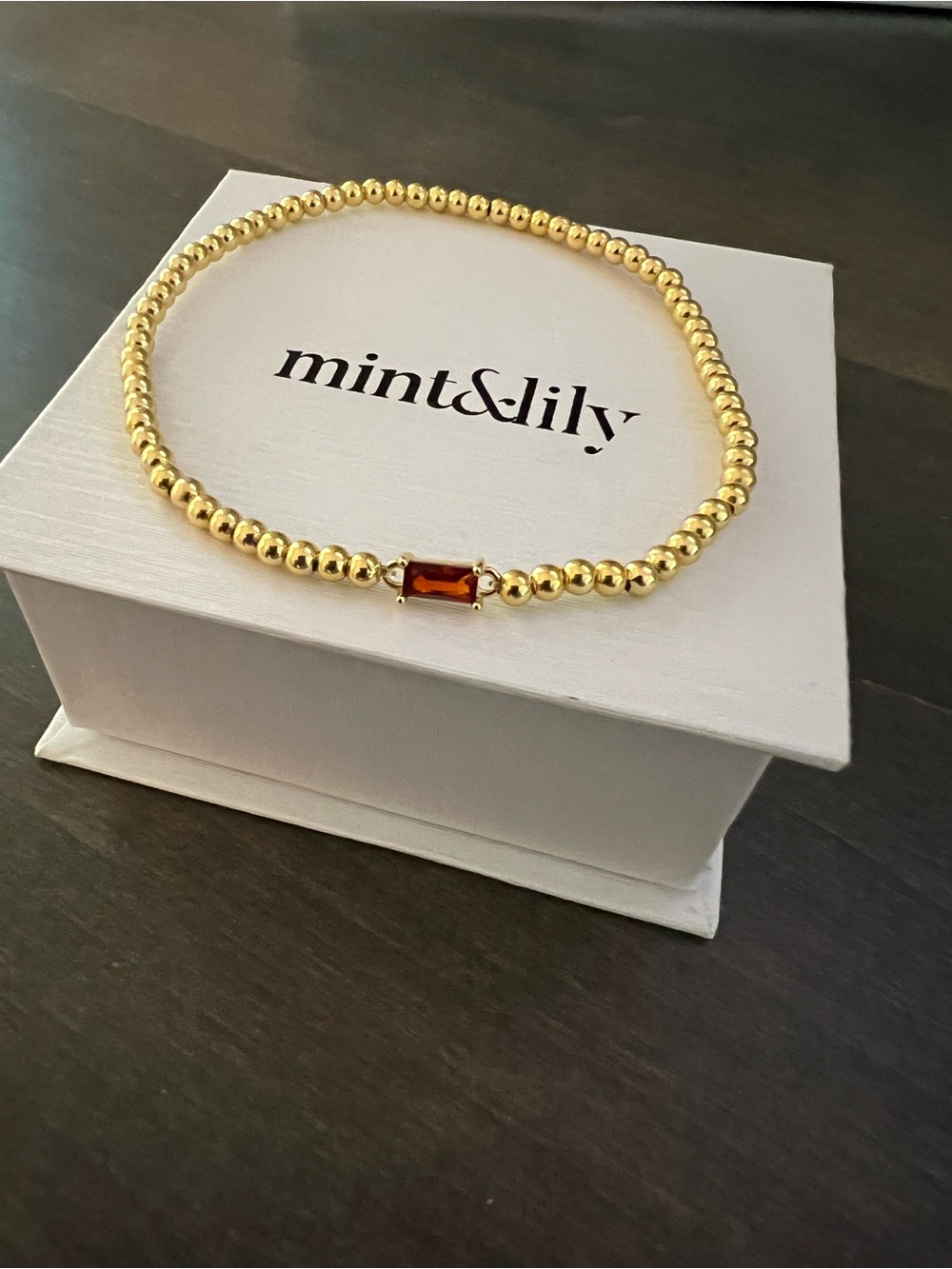 Gold Beaded Bracelet with Grarnet Stone